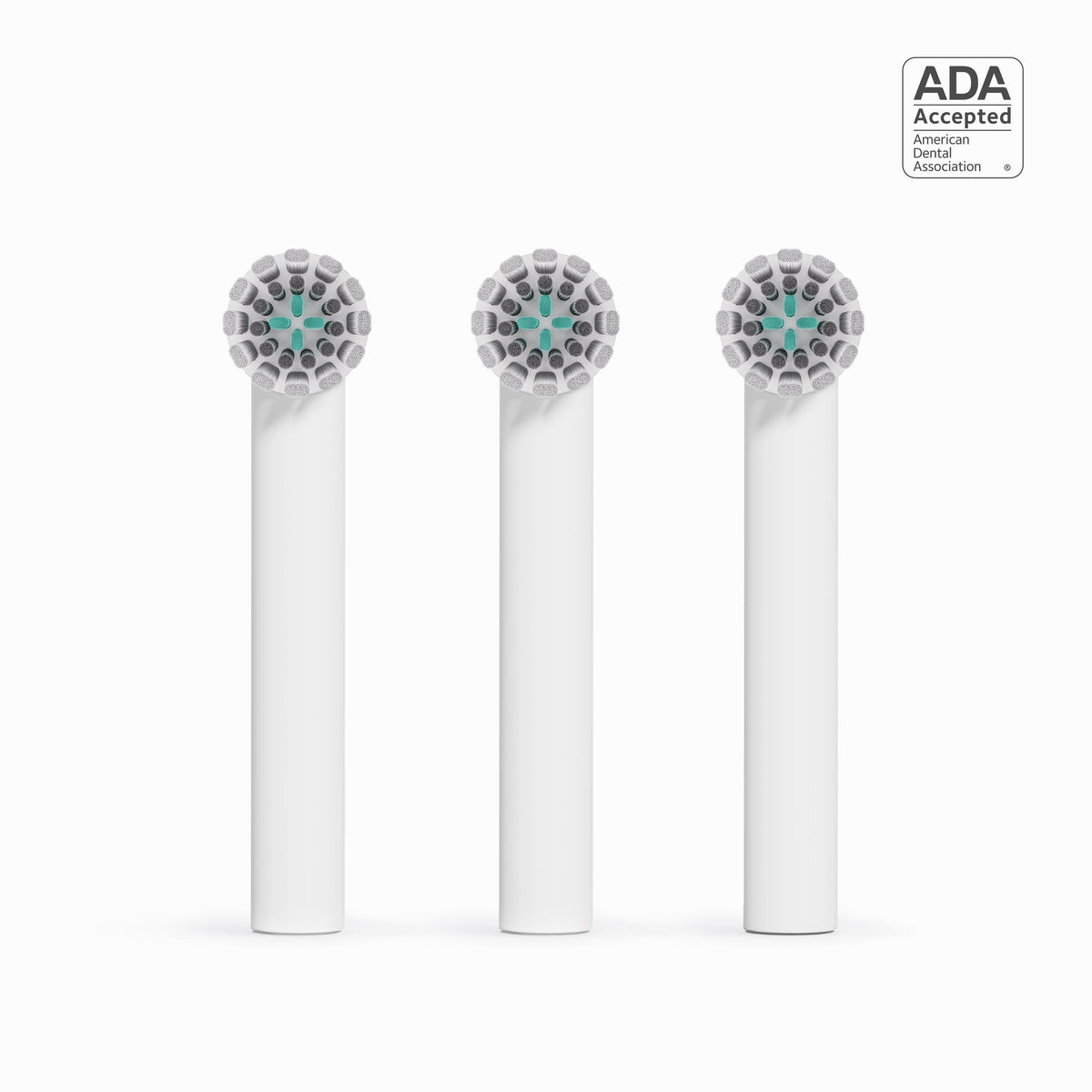 Three dental brush heads with ADA acceptance logo on a white background