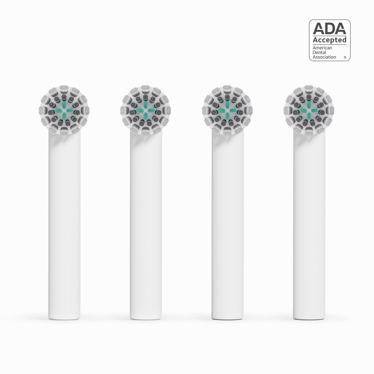 Four dental brush heads with ADA acceptance logo on a white background